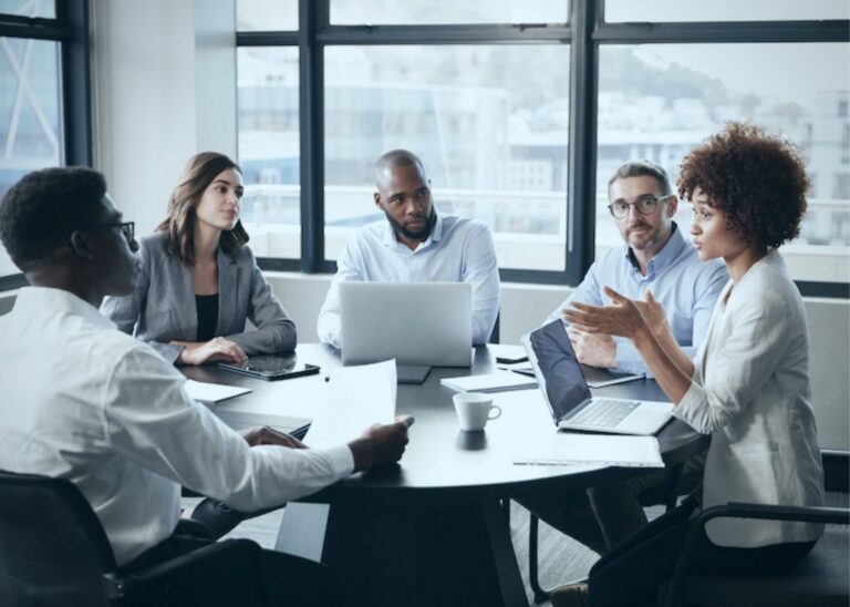 Business professionals meeting representative of discussion about the new NLRB Ruling