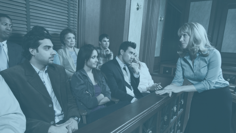 Jurors listening to a statement by a lawyer during a trial.