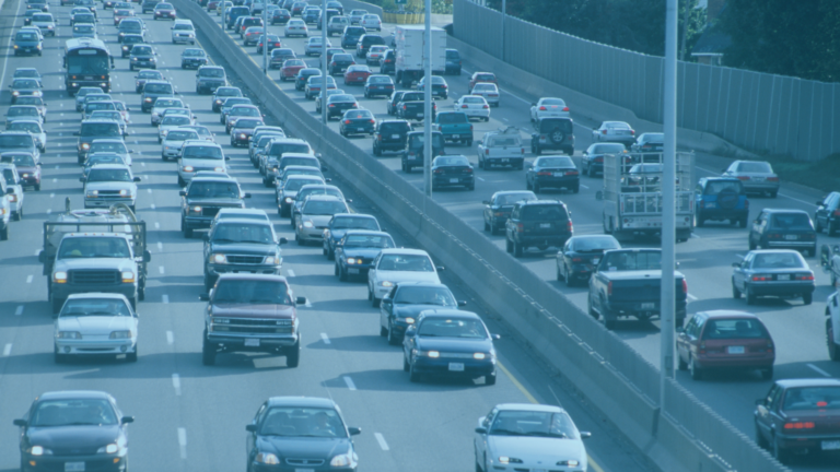 Multi-lane highway of crowded vehicles representative of article topic about automotive insurance claims